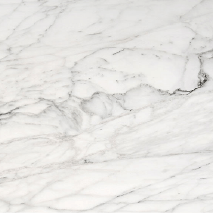 “Bianco Carrara marble slab with soft grey veining from Nujum Al-Rukham in Saudi Arabia.”