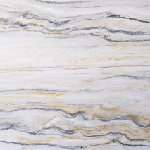 “Burber Gold granite slab with white, grey, and golden wave patterns from Nujum Al-Rukham in Saudi Arabia.”