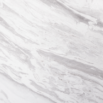 “Galaxy marble slab with white base and soft grey flowing patterns from Nujum Al-Rukham in Saudi Arabia.”