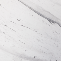 “Greece Statuarietto marble slab with white base and linear grey veining from Nujum Al-Rukham in Saudi Arabia.”