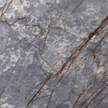 “Ice Grey marble slab with grey base and golden-brown veining from Nujum Al-Rukham in Saudi Arabia.”