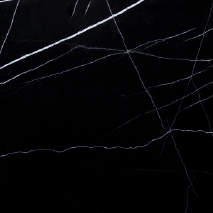 “Nero Marquina marble slab with deep black surface and white veining from Nujum Al-Rukham in Saudi Arabia.”