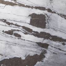 “Antique White marble slab with bold grey and dark veining from Nujum Al-Rukham in Saudi Arabia.”