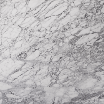 “Arabescato marble slab with intricate grey veining from Nujum Al-Rukham in Saudi Arabia.”