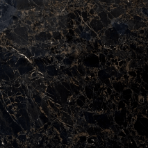 “Portoro Gold marble slab with deep black background and golden veins from Nujum Al-Rukham in Saudi Arabia.”