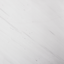 “Sivec white marble slab with subtle grey linear veins from Nujum Al-Rukham in Saudi Arabia.”